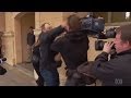 TV cameraman punched in face outside court