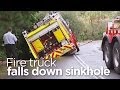 Fire truck falls into sinkhole